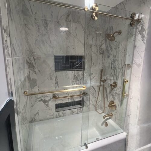 Frameless Barn door frameless shower enclosure satin brass crescent series shower doors of Wilmington - Shower Doors of Wilmington